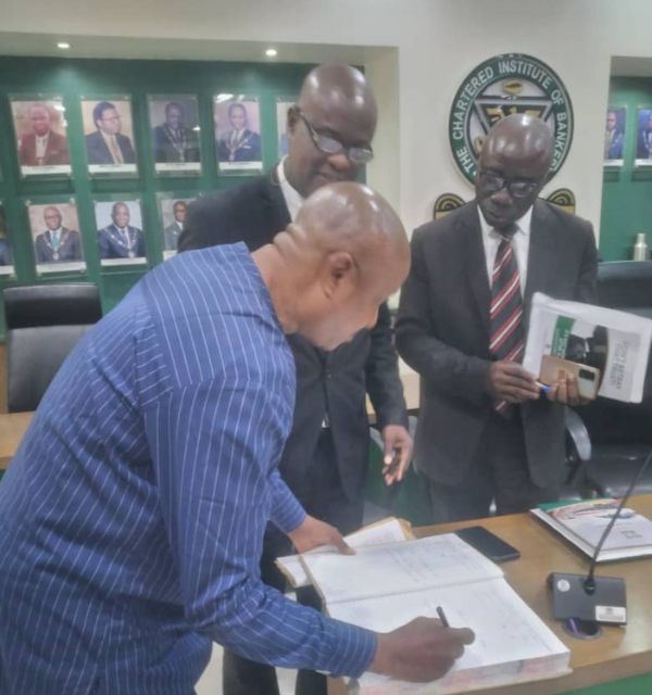 The APBE chairman, Dr. Charles Ogboi was signing the CIBN visitors register during our courtesy visit to the President/Chairman of Council  in the present of Prof. Babatunde Akinsanya and Prof. Kehinde Adetiloye.